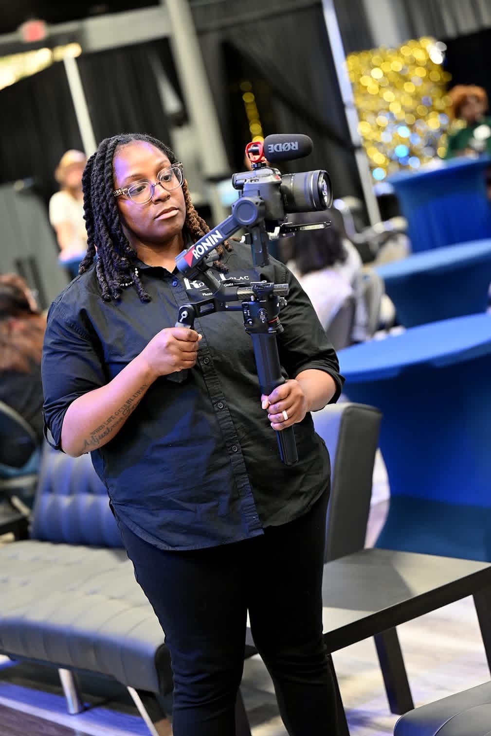 Rondasia Lamaria, founder of Royal Lilac Productions, operating a professional cinema camera on a gimbal