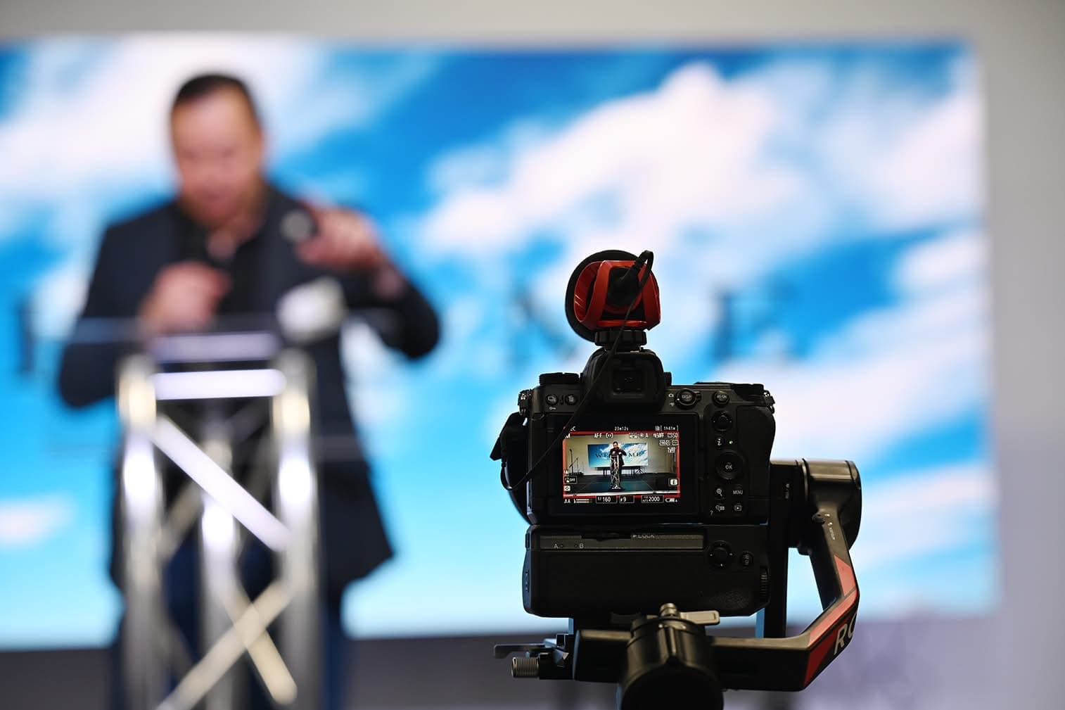 Professional cinema camera capturing a live presentation — Royal Lilac cinematic production